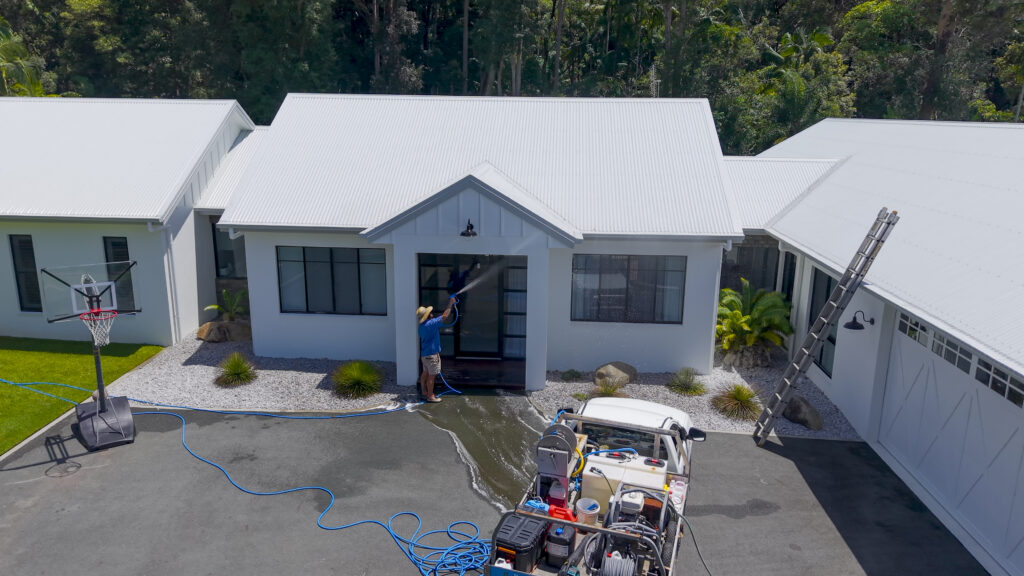 top down image of pressure clean experts cleaning residential home